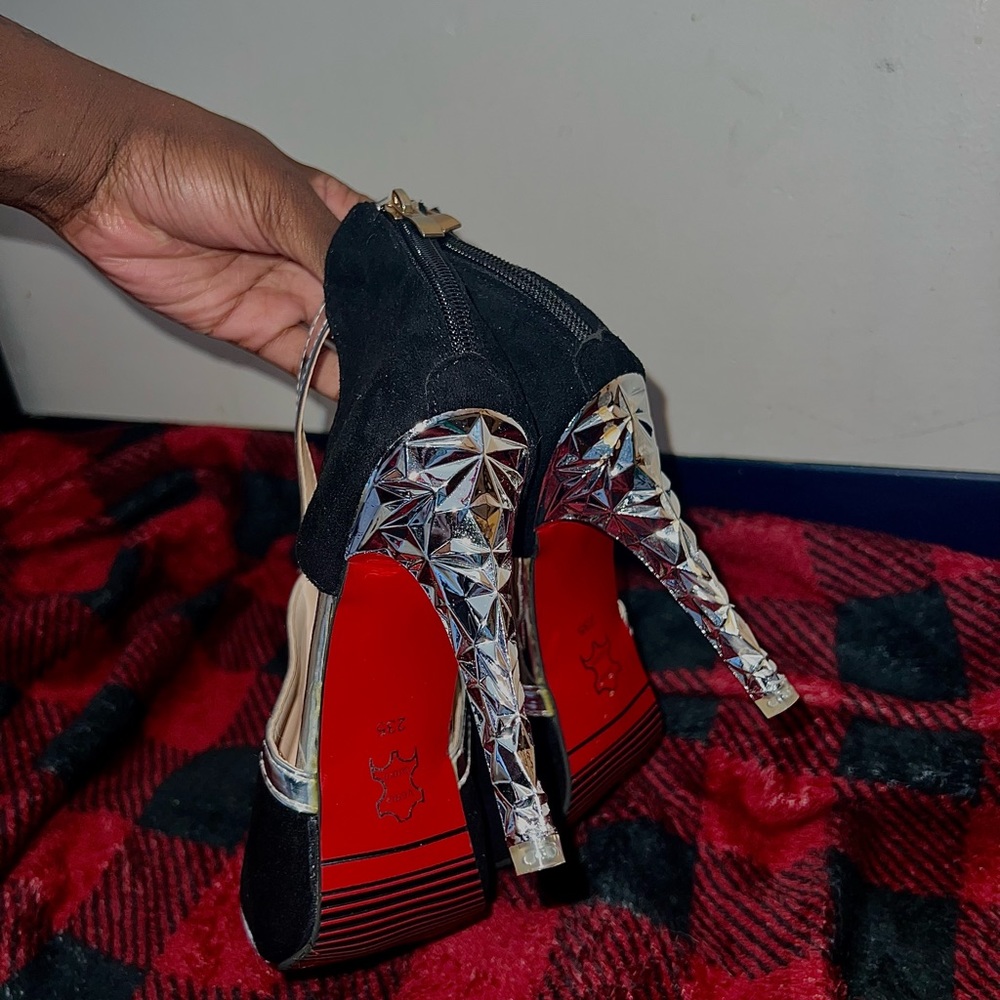 - Black and silver heels with red bottoms